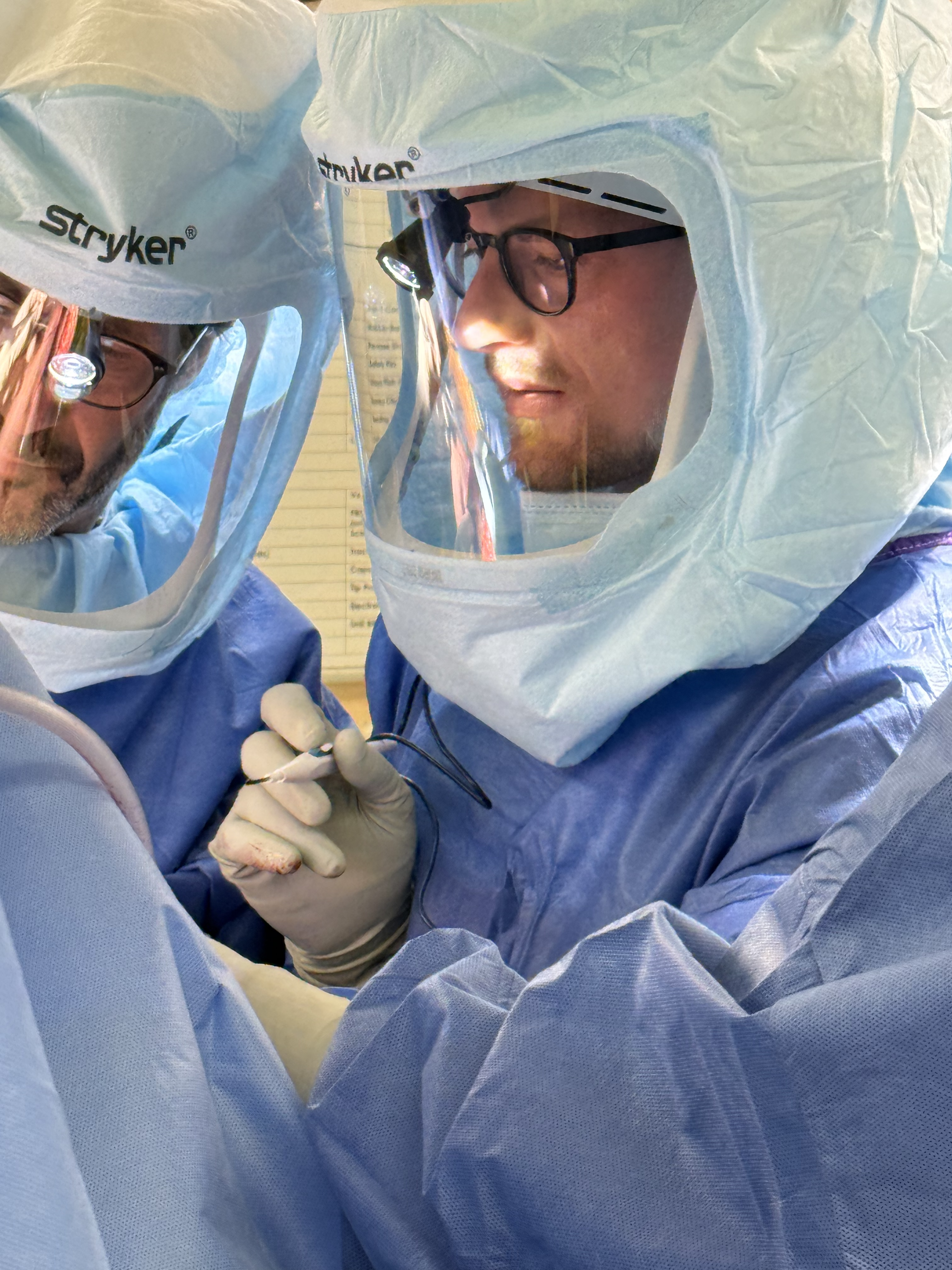 Dr. Josiah Valk performing orthopedic surgery in a hospital operating room